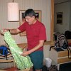 Francisco looking at a dress he bought for one of his nieces