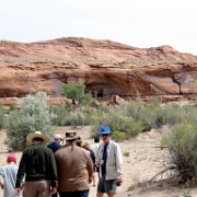 Bill and our group walk toward a puebloan cliff dwelling